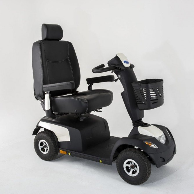 A black and white scooter with a basket on the front