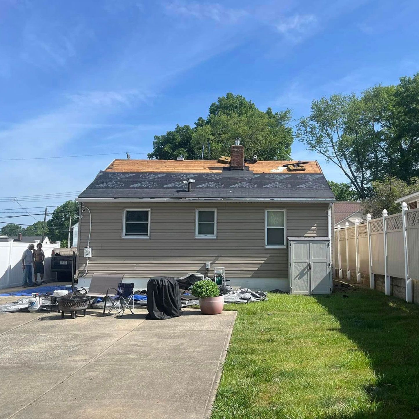 A house with a roof that is being repaired