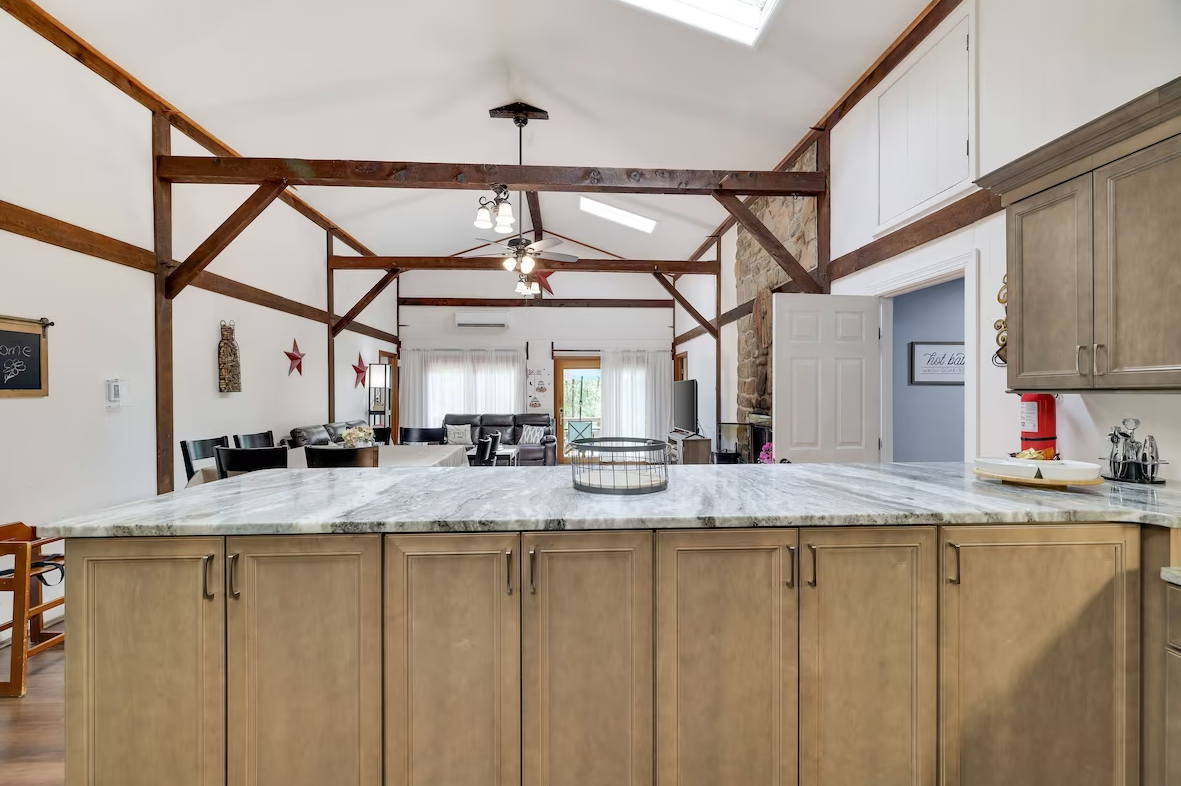 There is a large island in the middle of the kitchen.