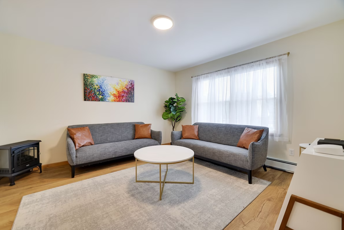 A living room with two couches and a coffee table.