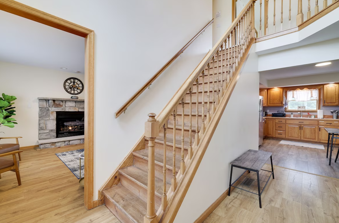 A wooden staircase leading up to the second floor of a house