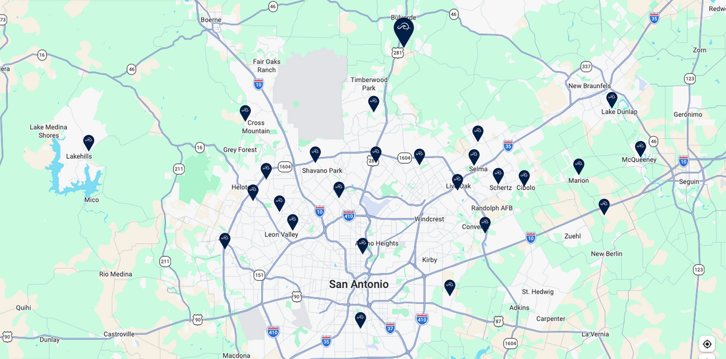 Map of a city with several blue location markers, possibly indicating points of interest.