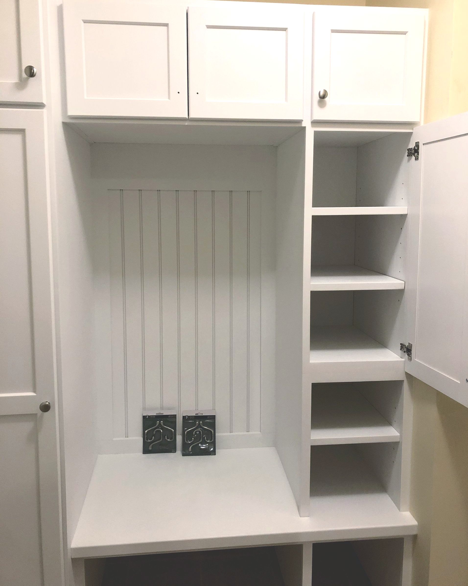 white shelf for shoes and coats