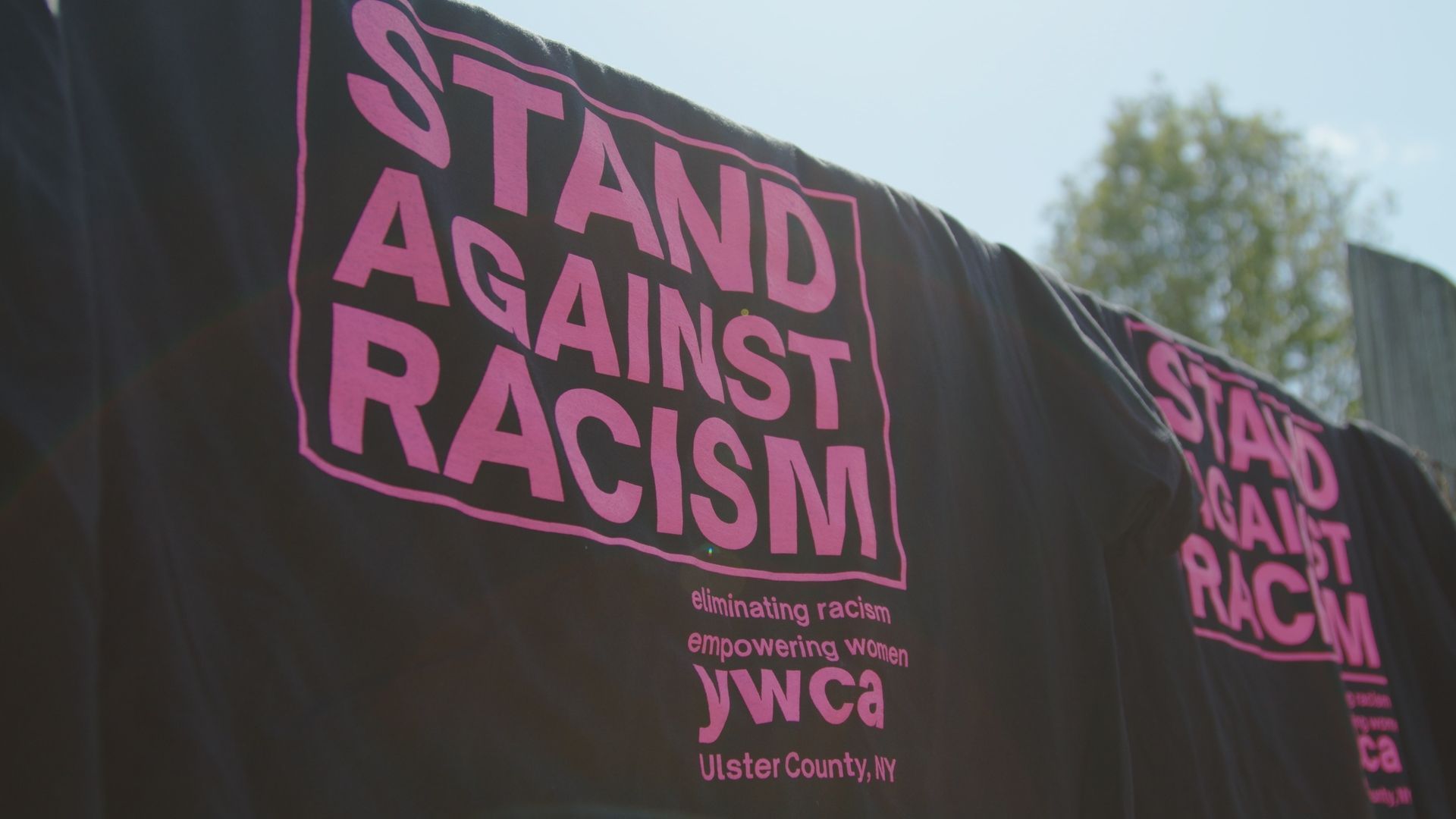 Black t-shirts with pink text