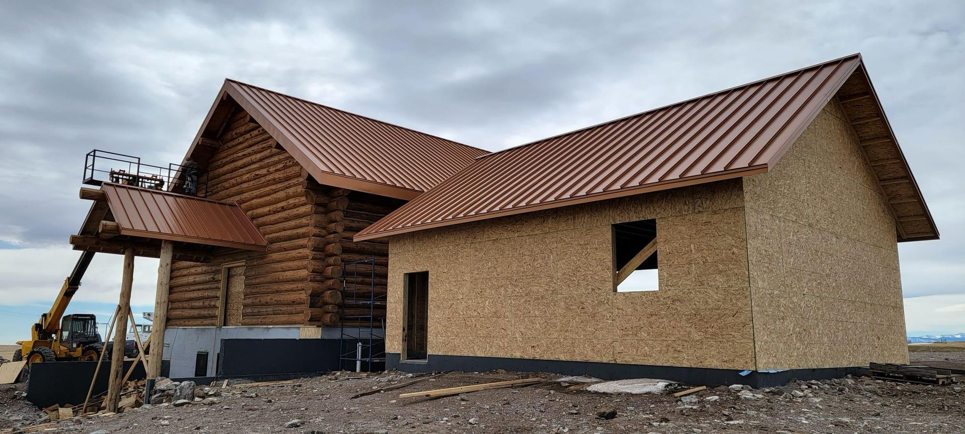A house that is being built with a red roof