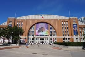 A large brick building with a large billboard on the front of it.