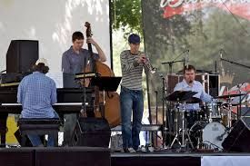 A group of men are playing instruments on a stage.
