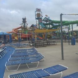 A water park with a lot of chairs and a water slide.