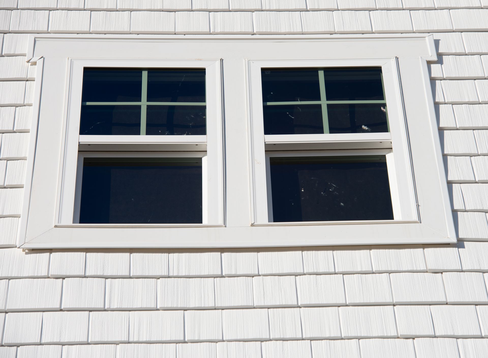 Double hung window sash and hardware mid-installation