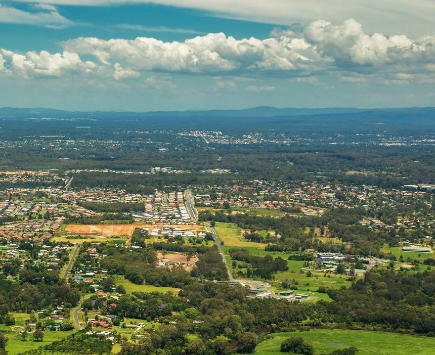 Aerial View of a Suburban Landscape With Scattered Houses — All Class Liquid Waste in Crows Nest, QLD