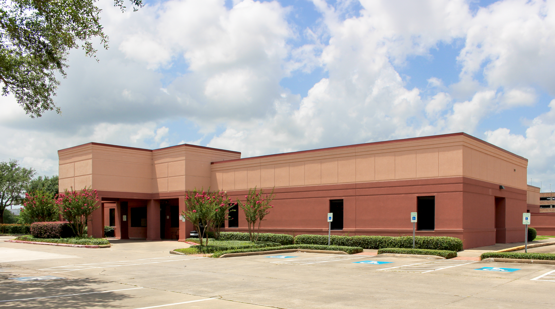 A white building with a blue awning and the word davita on it