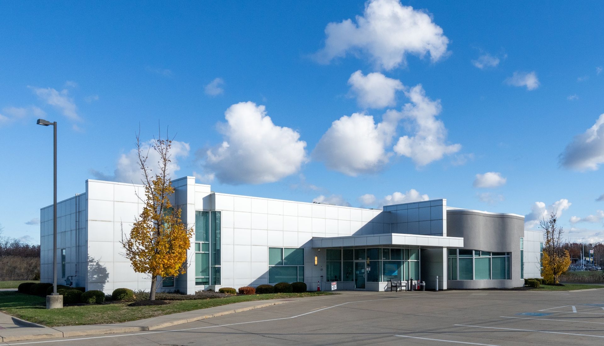 A white building with a blue awning and the word davita on it
