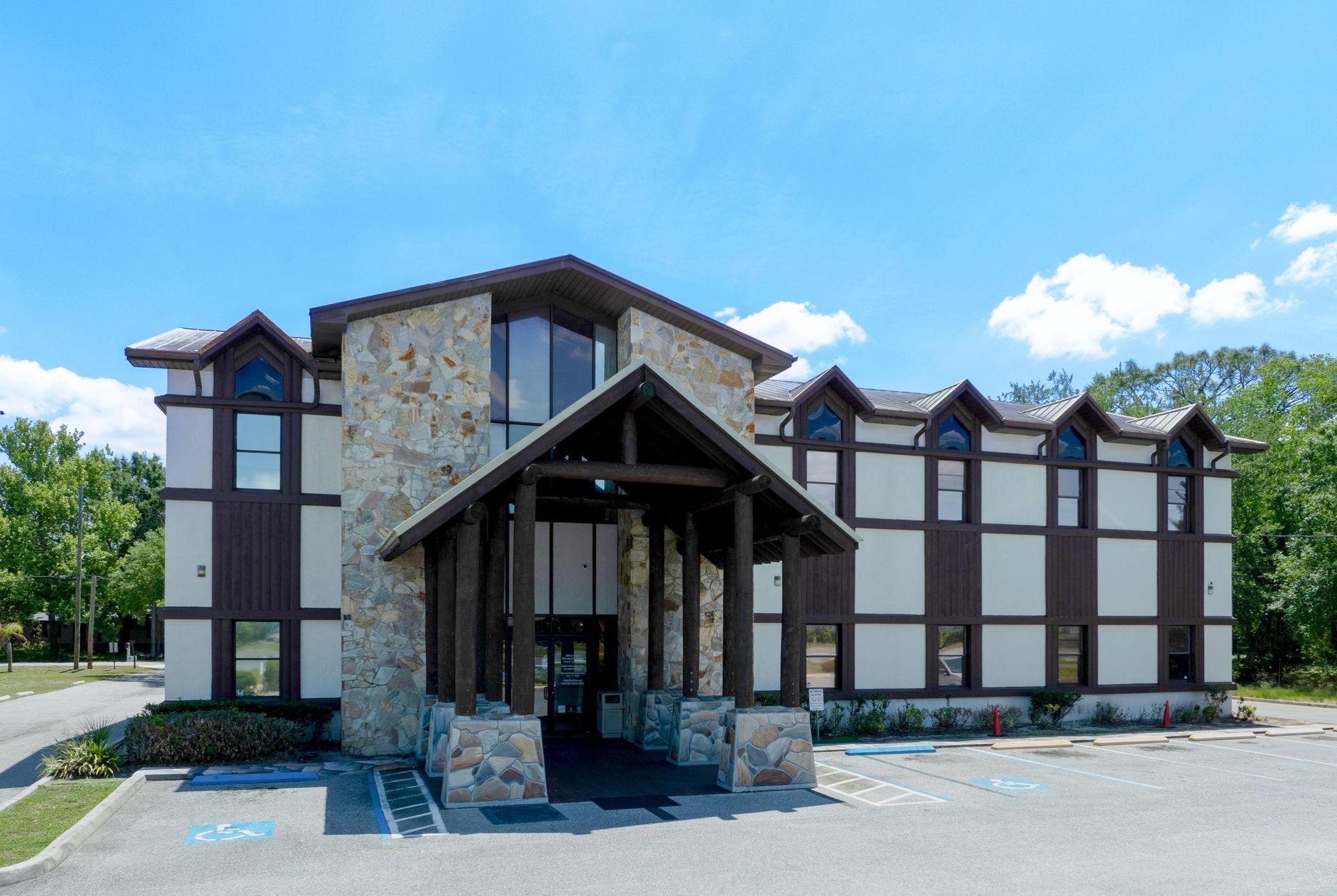 Single tenant net leased Pediatric Associates medical clinic with a covered entrance under a blue sky