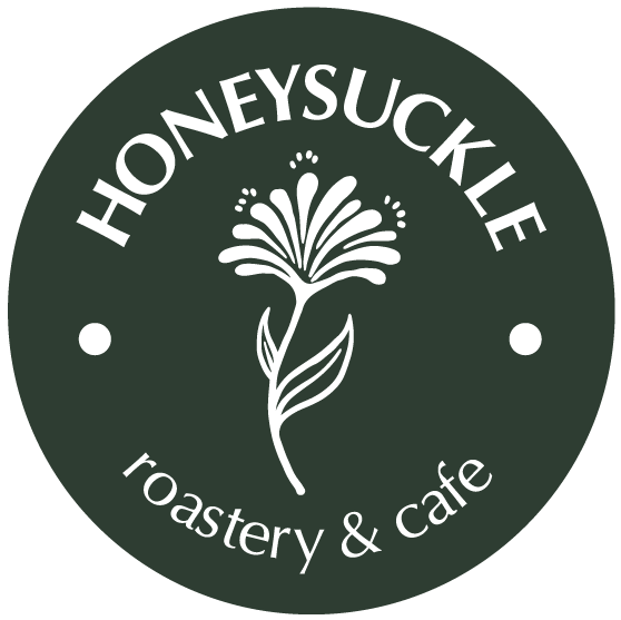 A honeysuckle roastery and cafe logo with a flower on it