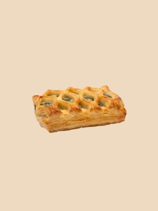 A close up of a pastry on a white background.