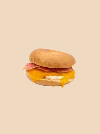 A sandwich with lettuce , tomatoes and cheese on a white background.