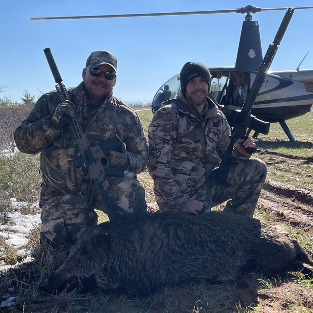 Two happy heli-hog hunters