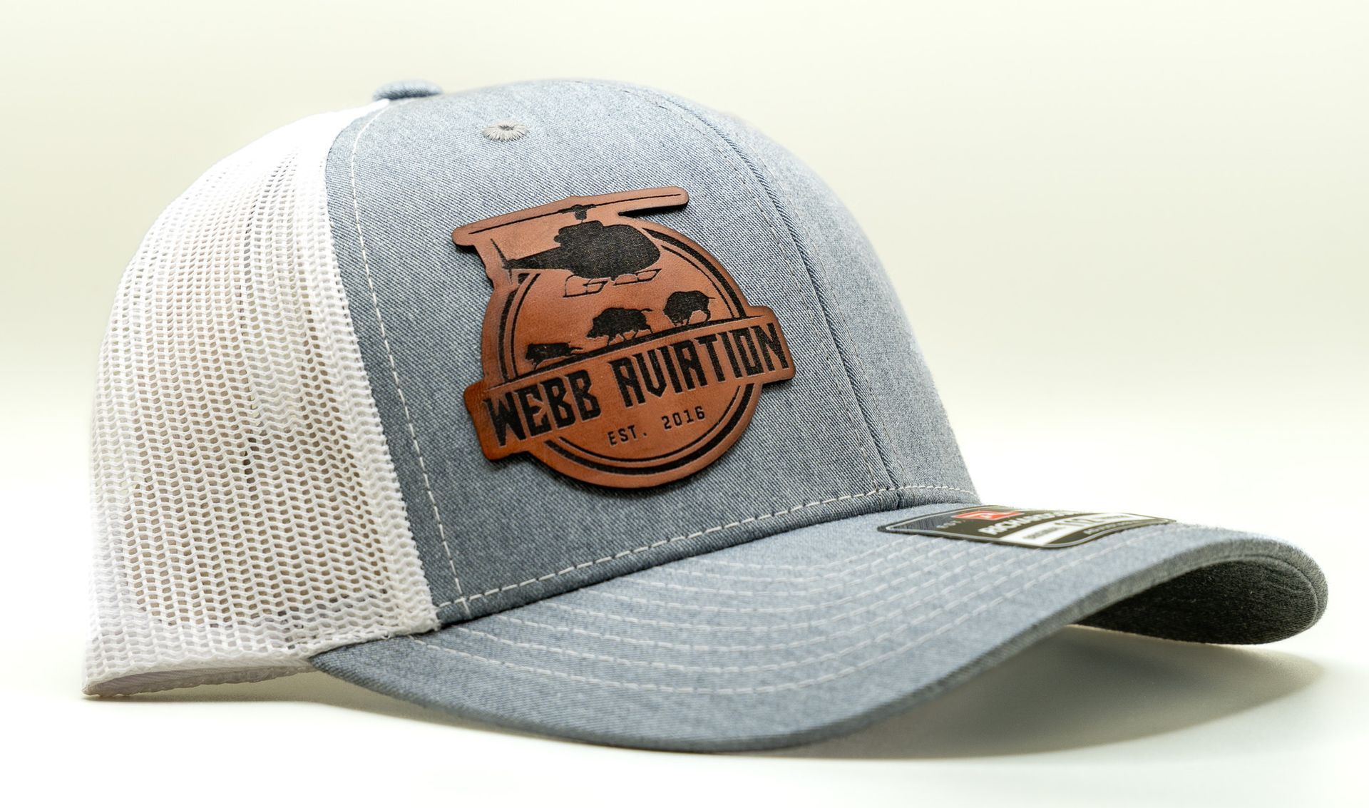 Gray and white mesh baseball cap with a brown leather “Beer Run” patch on the front