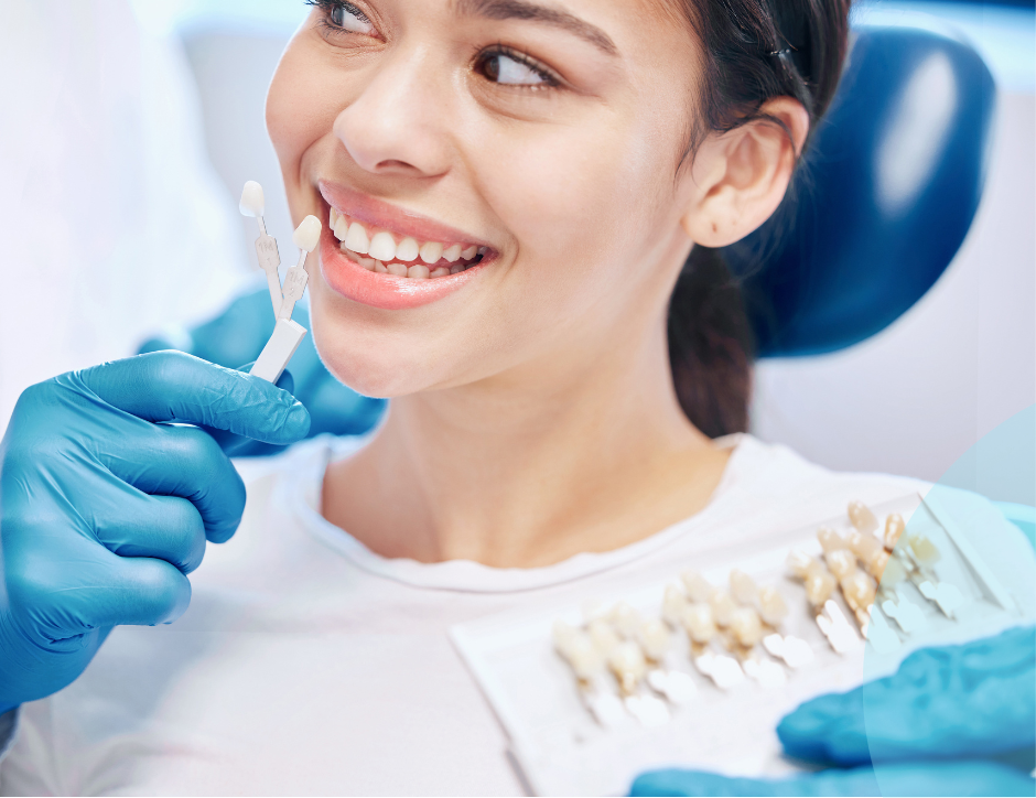 Woman in dental chair reviewing veneer options