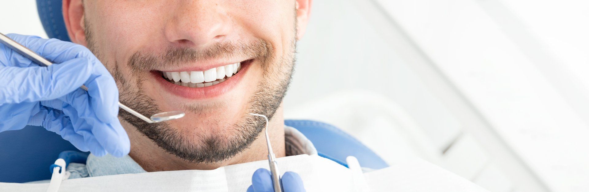 Man in dental chair smiling