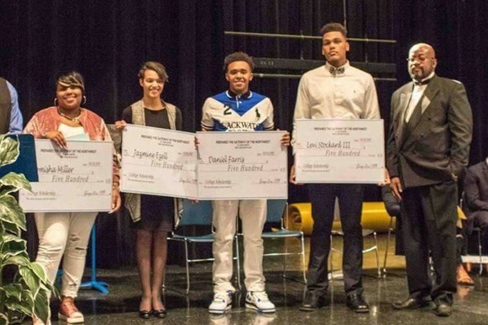 Teenagers receiving certificate