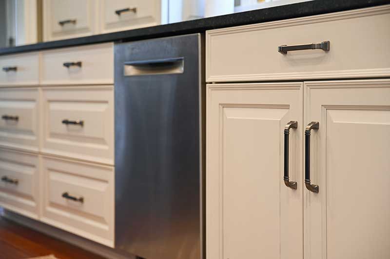 White Cabinets and a Stainless Steel Dishwasher | Nerstrand, MN | Nerstrand Custom Cabinets