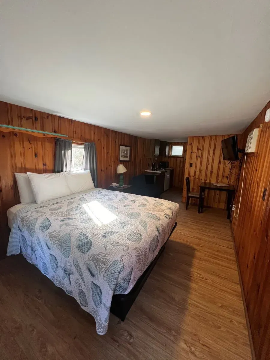 There is a king size bed in the middle of the room.