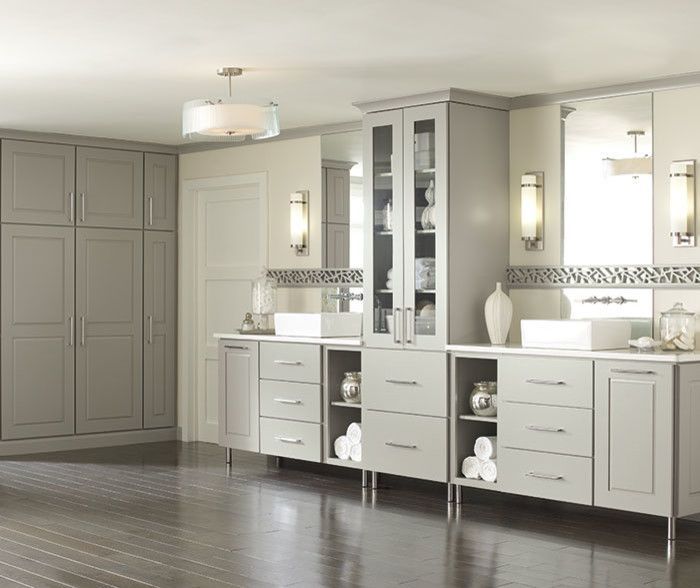 A bathroom with two sinks and a large mirror