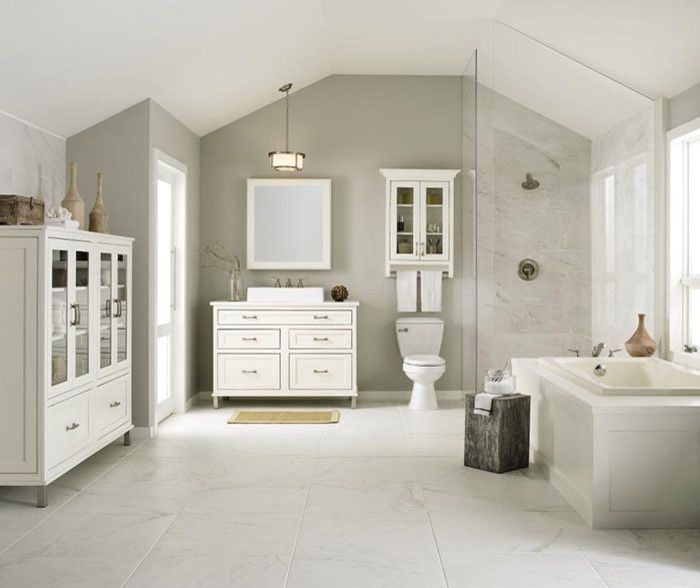 A bathroom with a sink toilet and bathtub
