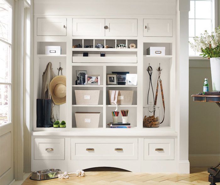 A hallway with lots of shelves and drawers