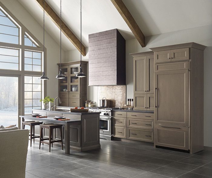 A kitchen with a lot of cabinets and appliances