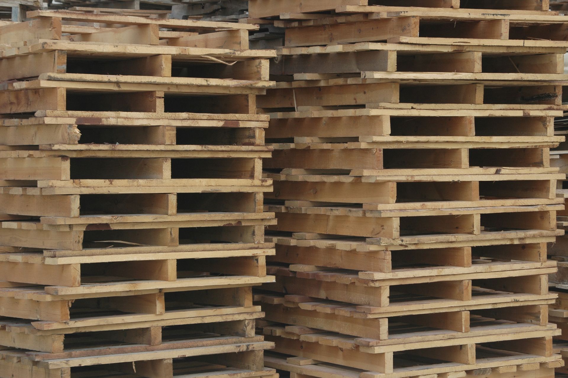 A pile of wooden pallets stacked on top of each other