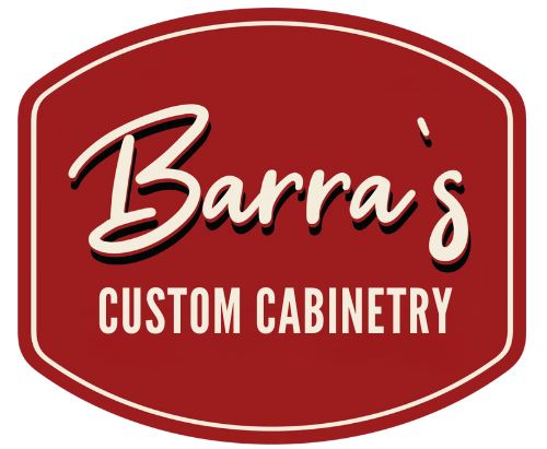 Logo for Barra's Custom Cabinetry, with white cursive text on a maroon oval, outlined in white.