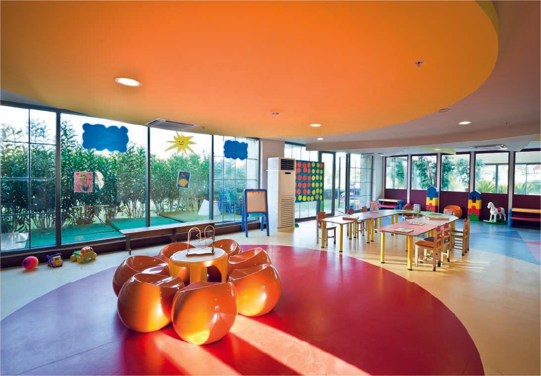 A large room with tables and chairs in it
