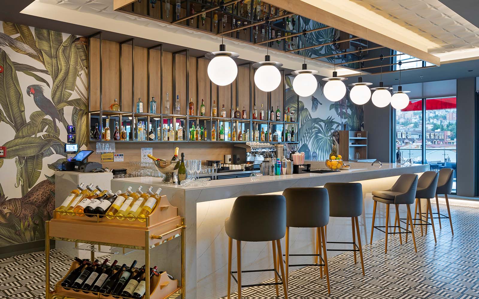 A bar with a lot of bottles of wine on it.