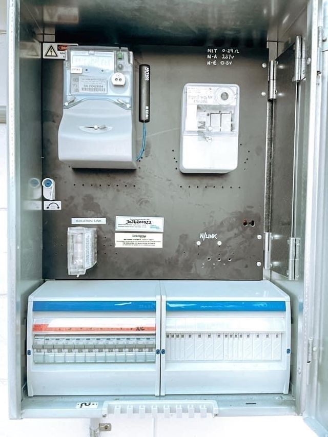 Electrical Panel With Meters, Breakers, and Wiring Inside a Metal Box — Hazlec Services Pty Ltd in Rockyview, QLD