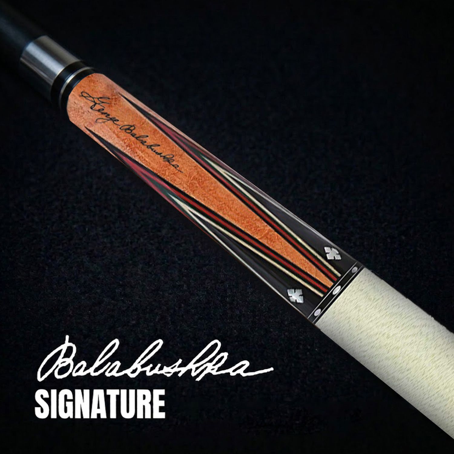 GB21 billiard cue close-up showing Balabushka signature engraving, birdseye maple forearm, and detailed veneer craftsmanship
