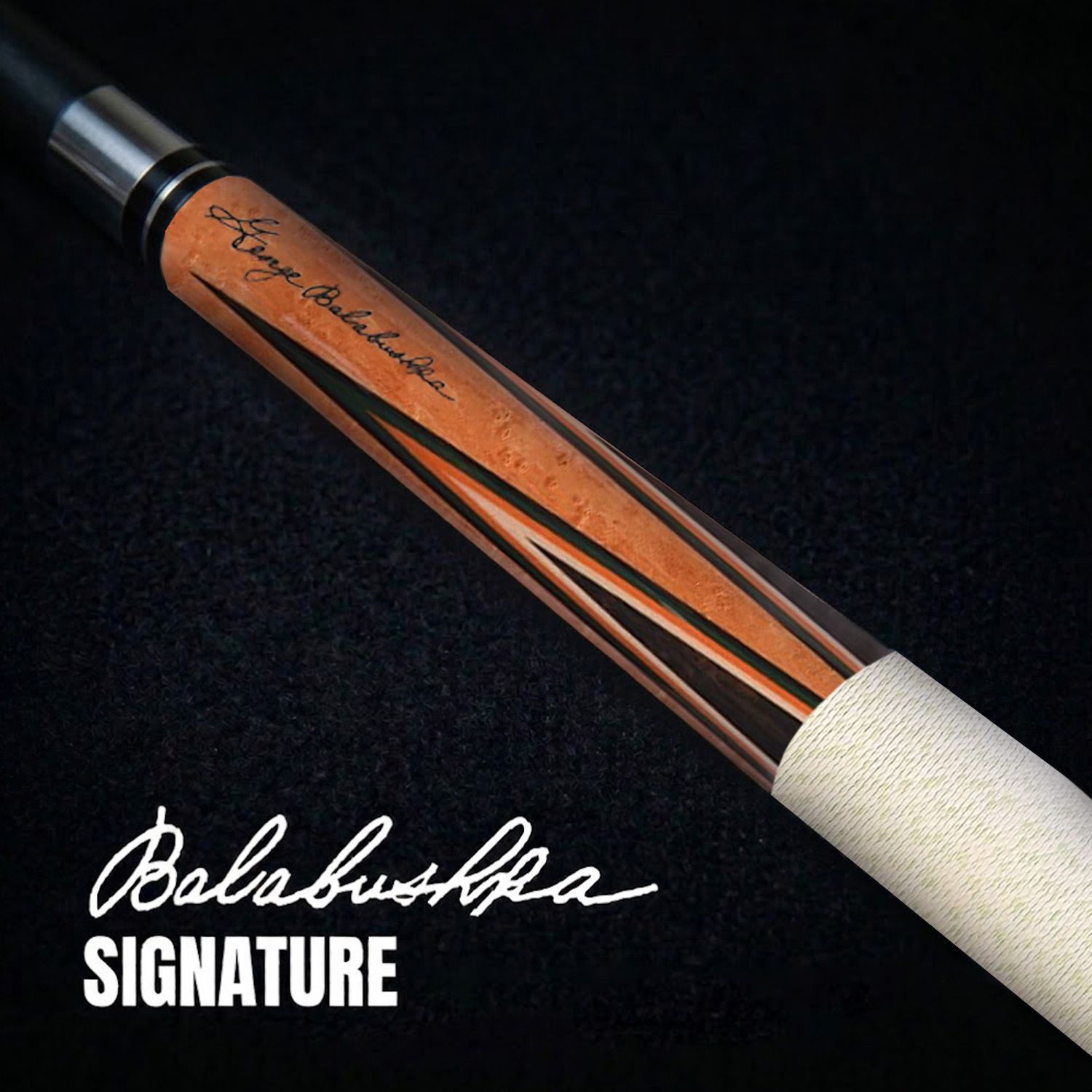 GB2 billiard cue close-up showing Balabushka signature engraving and detailed wood grain finish