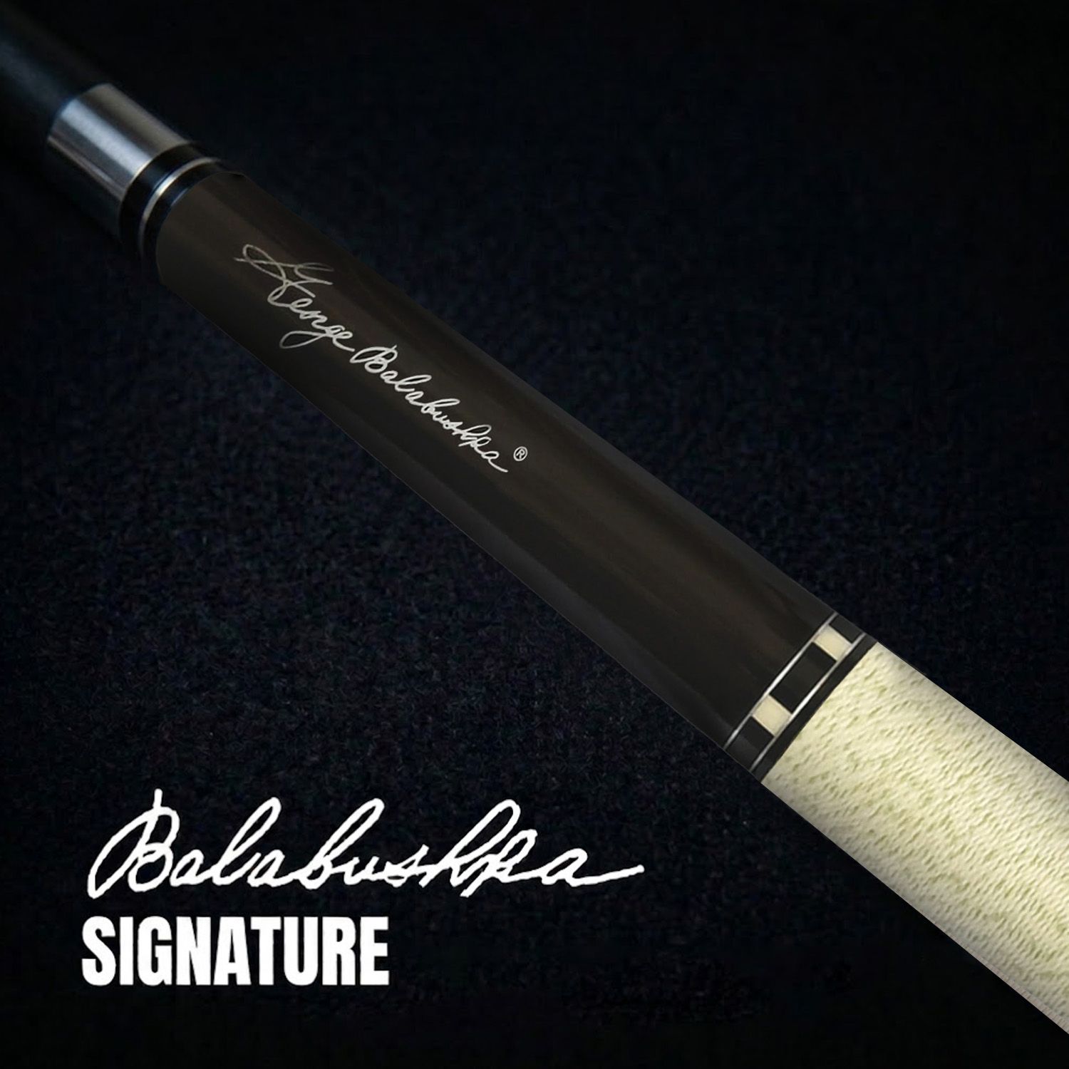 GB25 billiard cue close-up showing George Balabushka signature, smooth rosewood grain, polished black finish, white Irish linen wrap, and refined detailing