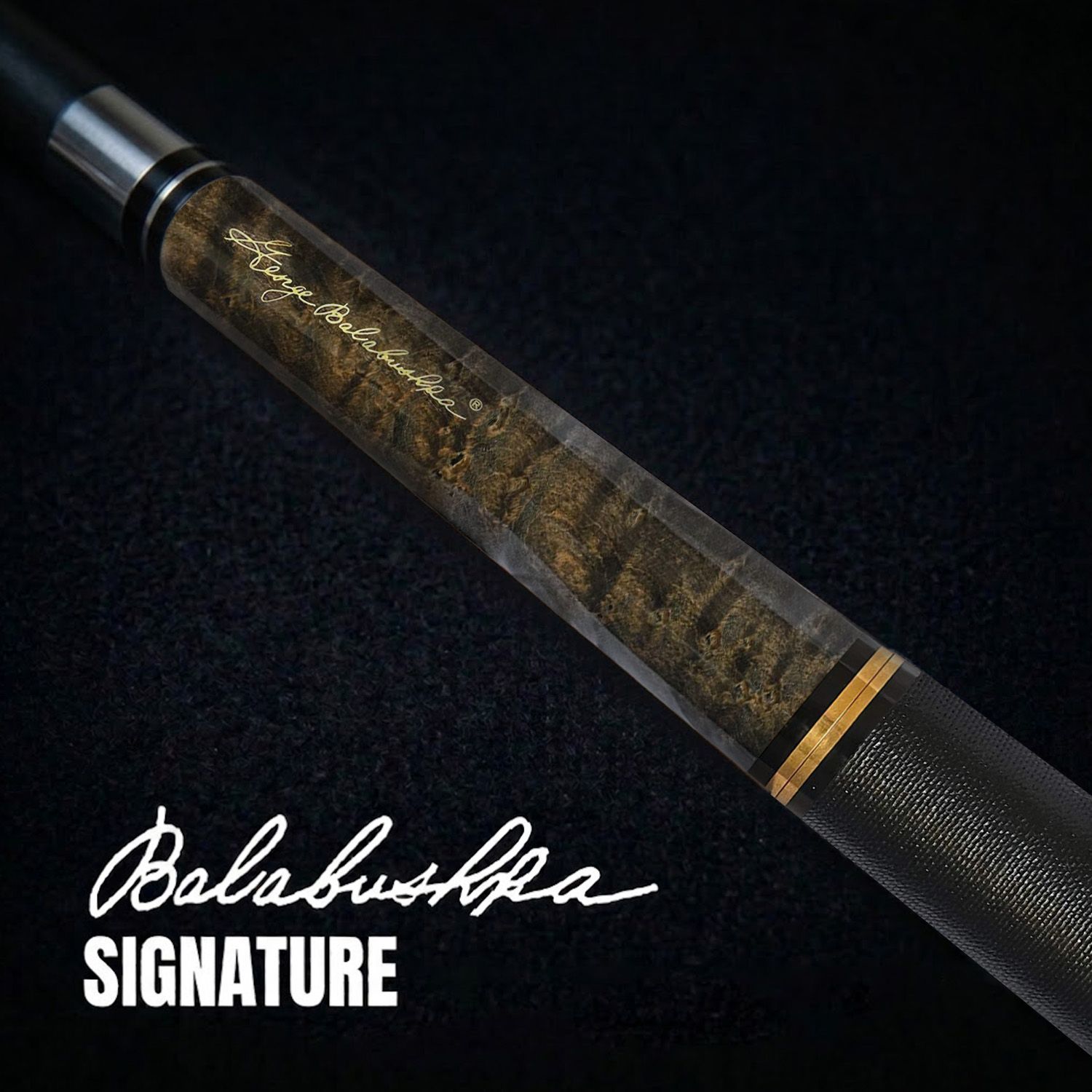 GBJBK-1 break/jump cue close-up showing George Balabushka signature, dark birdseye maple forearm, black textured wrap, and refined gold accent detailing