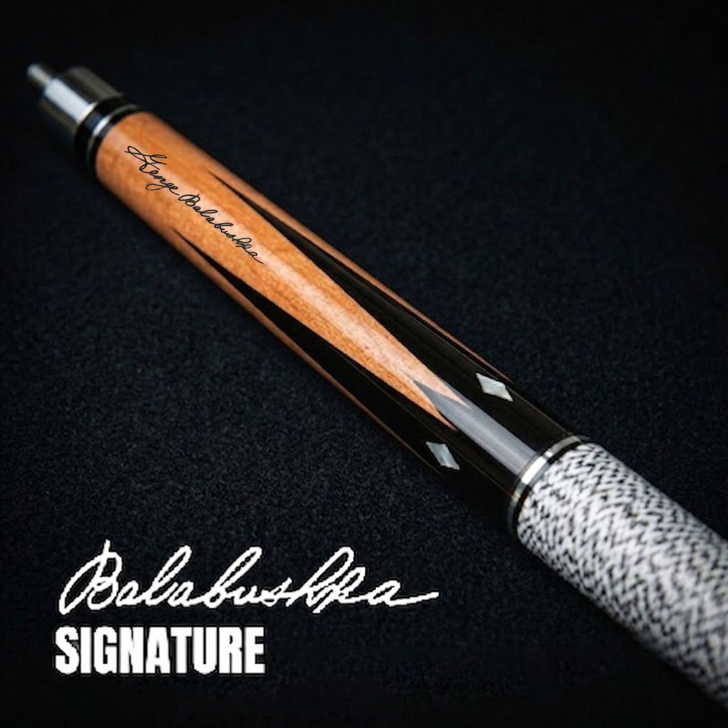 GB6 billiard cue close-up showing Balabushka signature engraving, ebony forearm details, and diamond inlay craftsmanship
