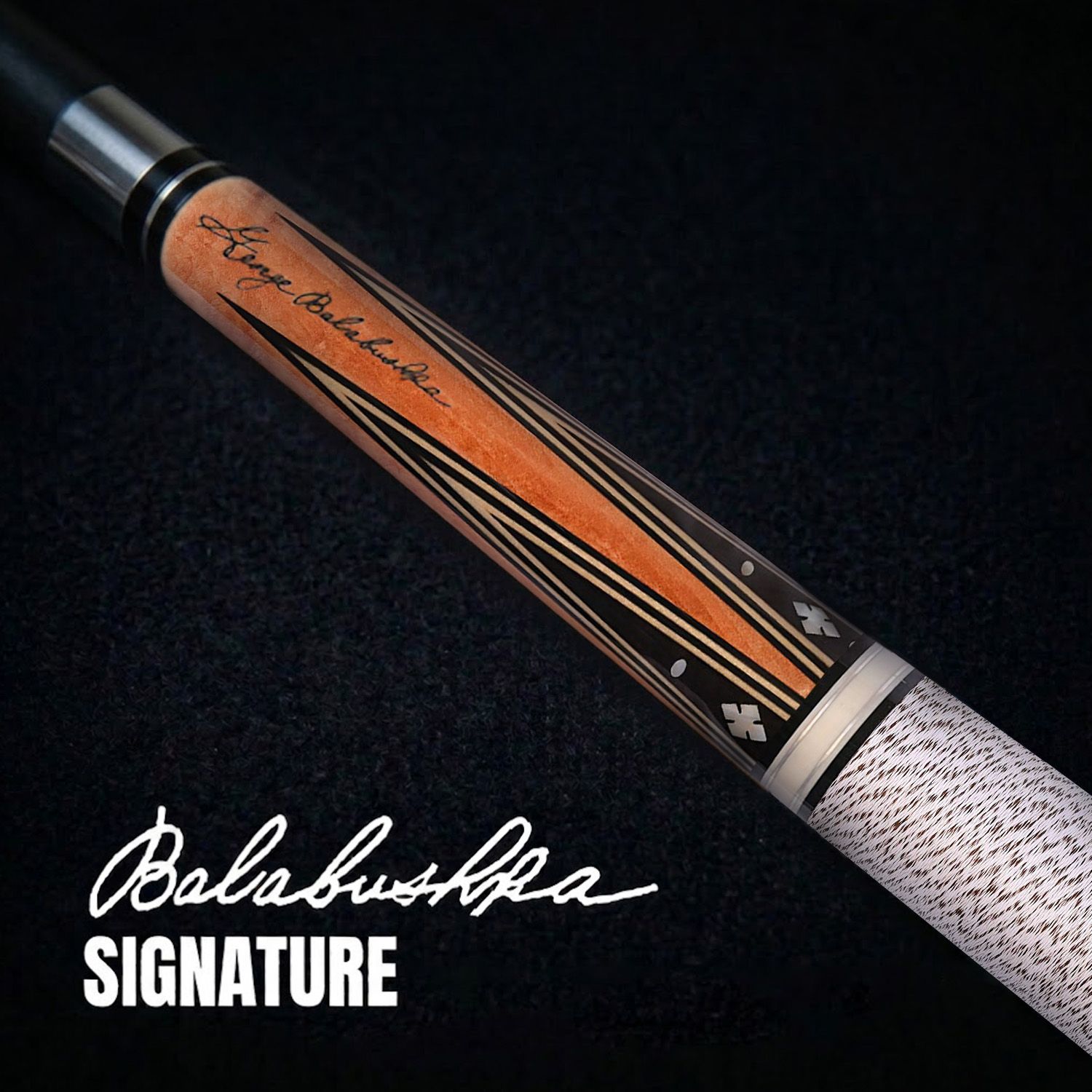 GB22 billiard cue close-up showing George Balabushka signature, birdseye maple forearm, ebony points, and decorative inlays