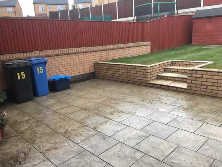 Fencing York large patio paving area in back garden with wall and steps in Haxby