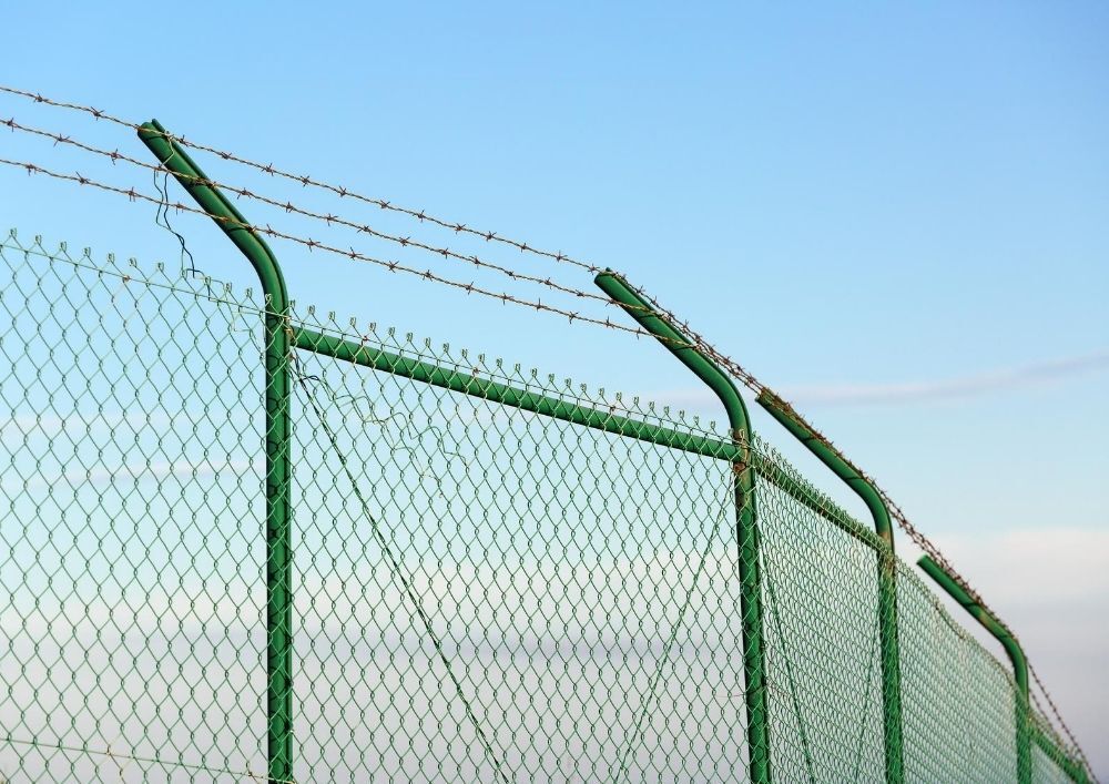 Mesh with barbed wire fencing in York