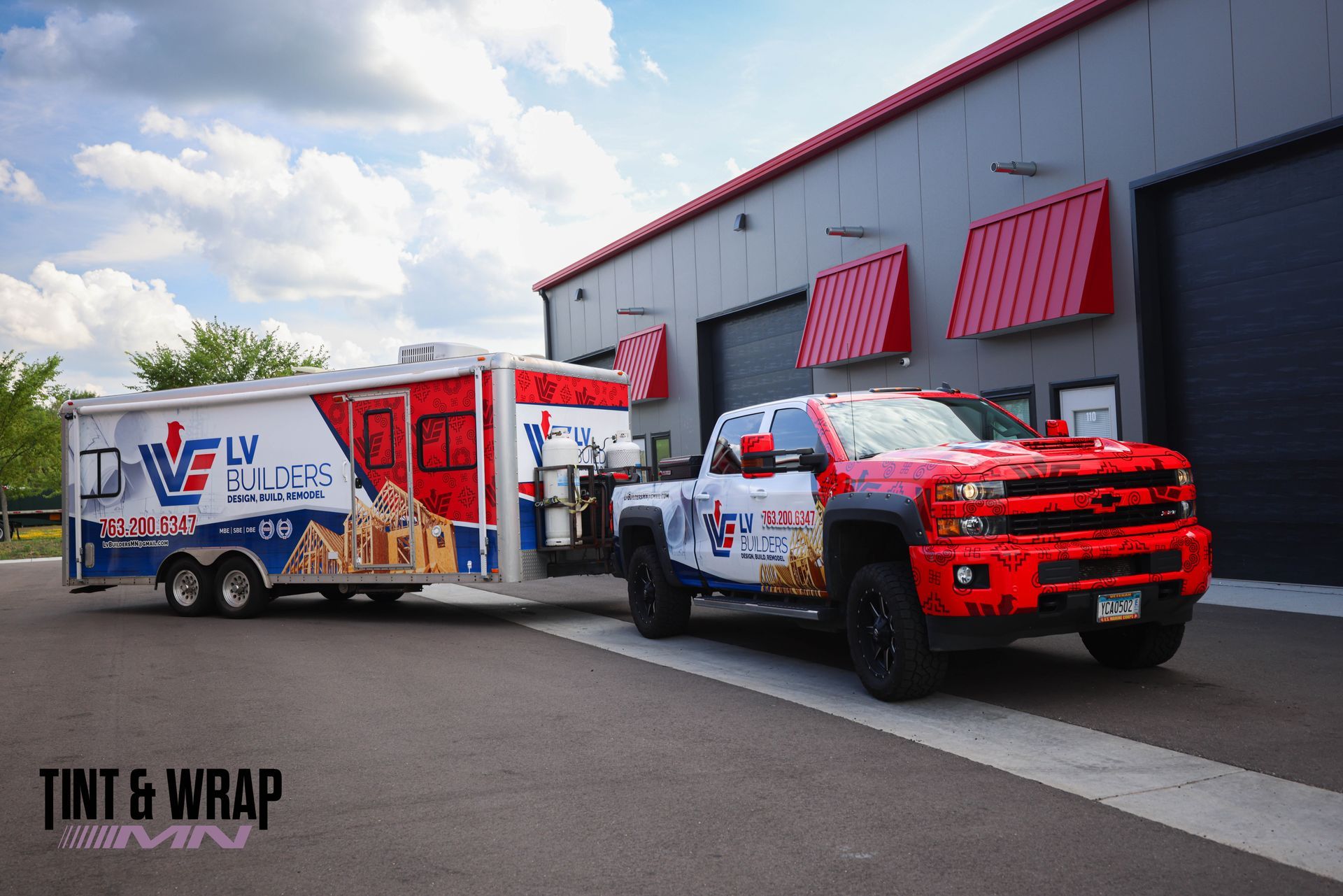 A red , blue and gray truck with a speed graphic on the side. A red , blue and gray truck with a speed graphic on the side.