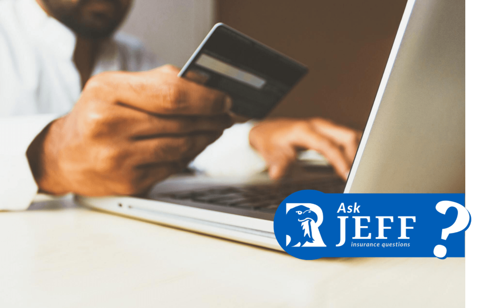 Man in front of computer with credit Card