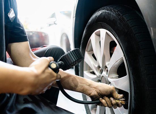 Repairing Car Tire — Peekskill, NY — American Cycle & Tire