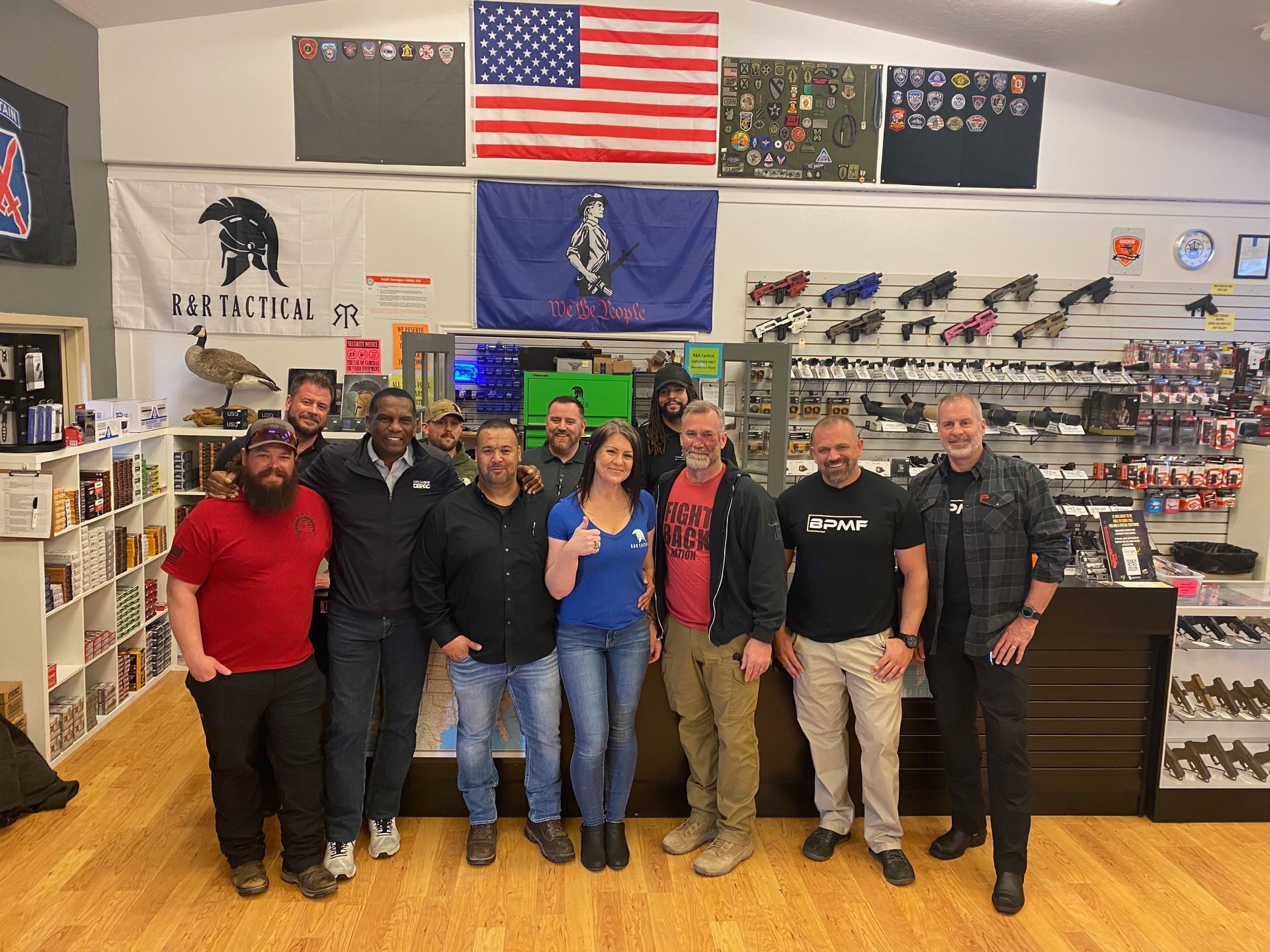 A group of people are posing for a picture in a store.