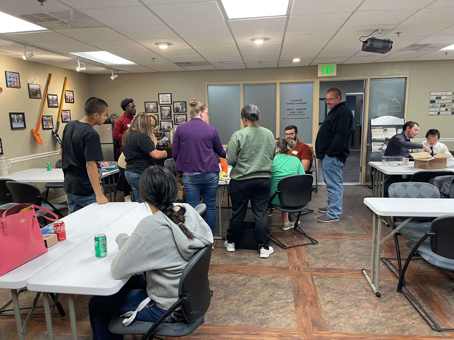 A group of people are sitting at tables in a room.
