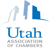 A blue and white logo for the utah association of chambers